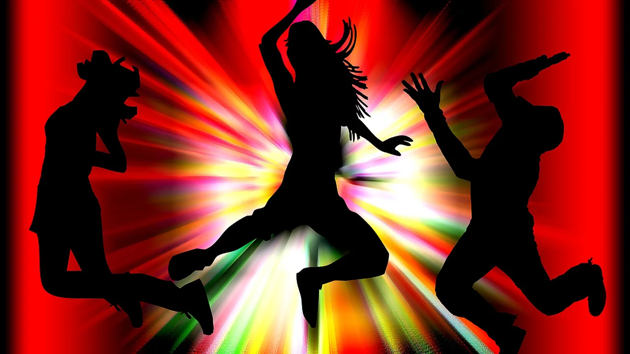 Two mint chocolate milkshakes with whipped cream and green sprinkles.