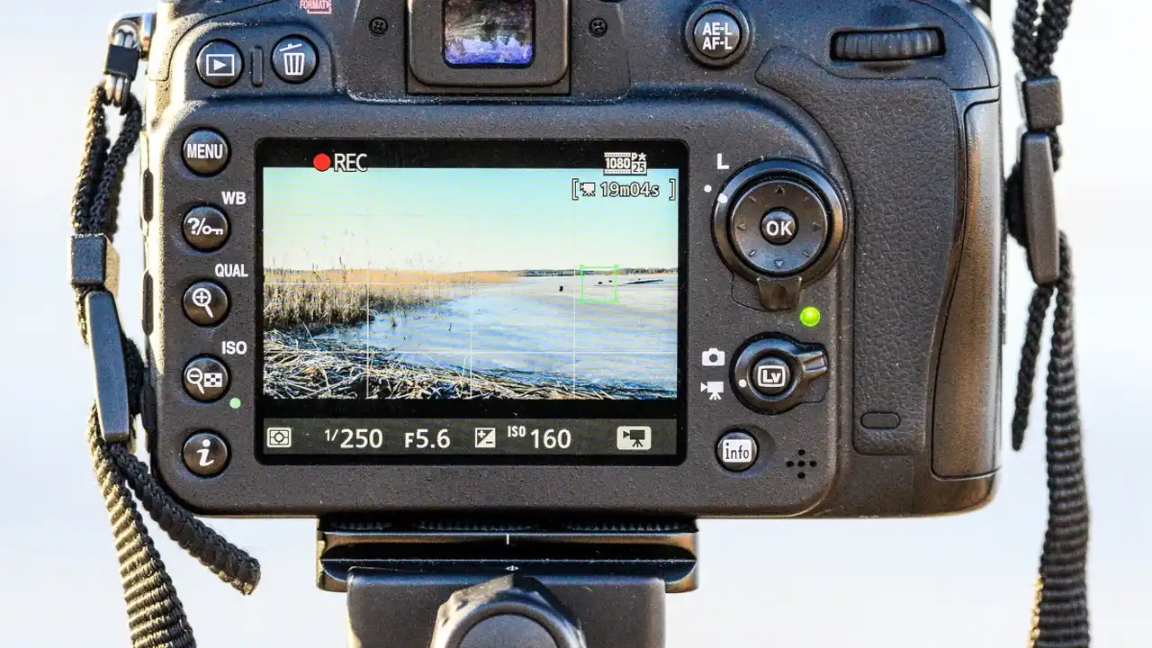 overhead view of corned beef sliced and on a platter with cabbage, potatoes, and carrots