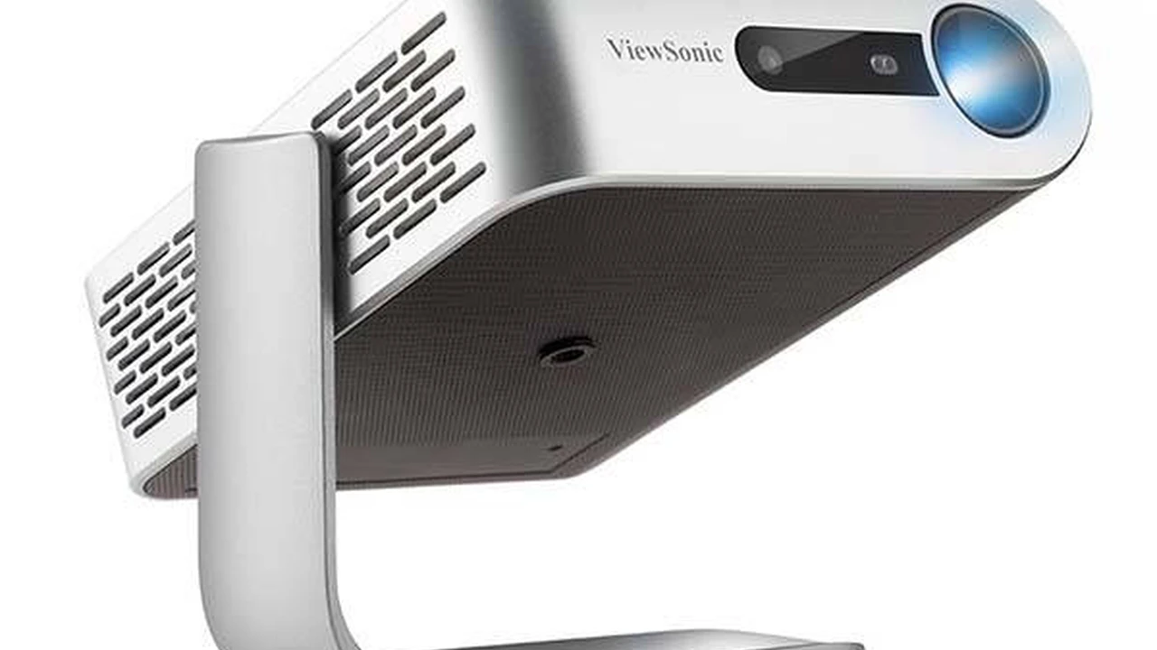 Two mint chocolate milkshakes with whipped cream and green sprinkles.